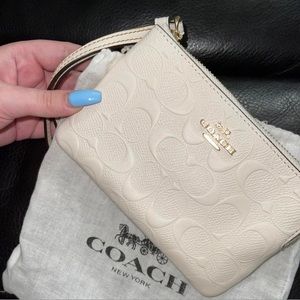 NEVER USED Coach mini wallet/coin bag!!! Tags still attached, bought in 2020.
